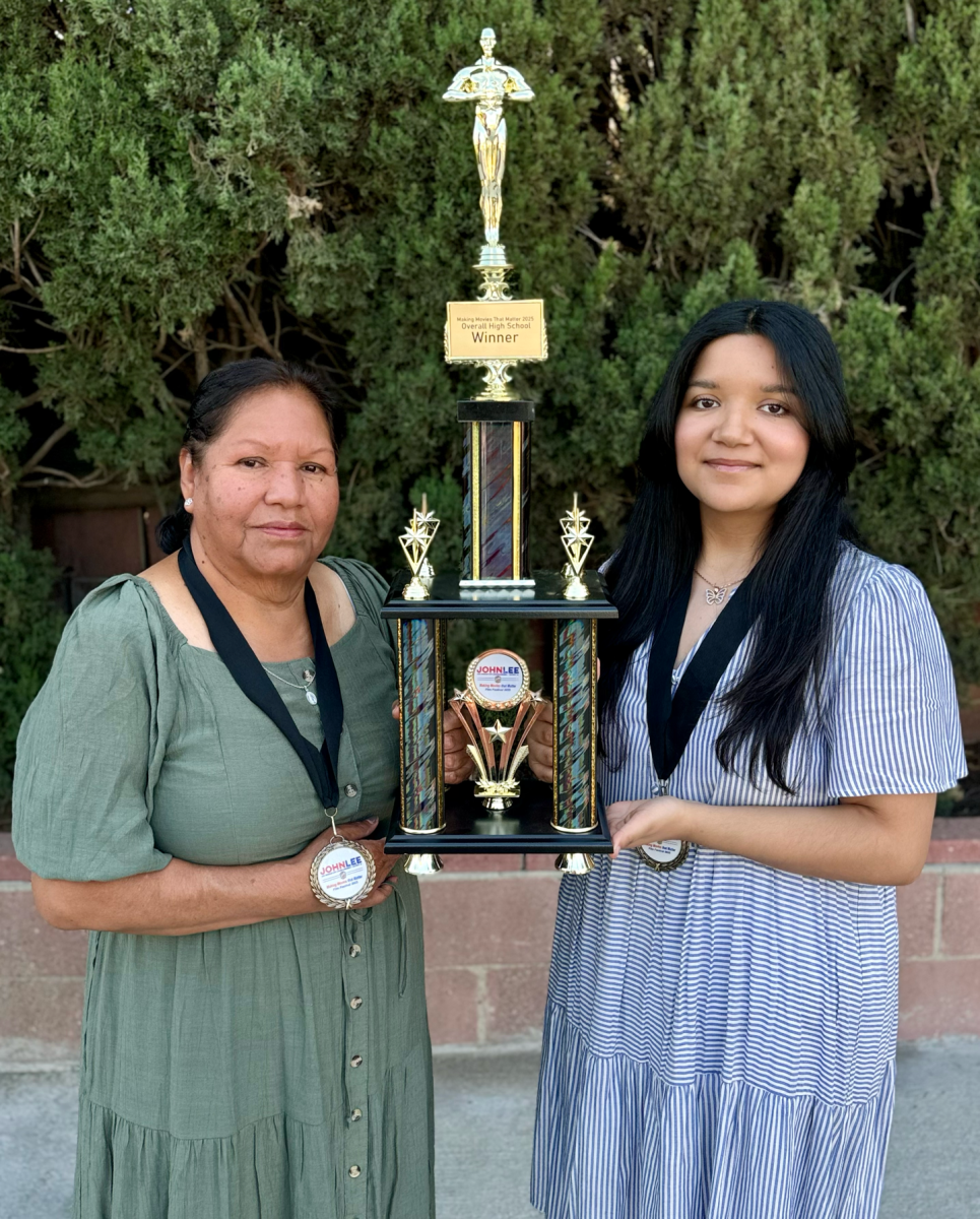 Arlene Hernandez (right) posed with star of her film, Deli Torres (left), with the trophy given by the film festival.